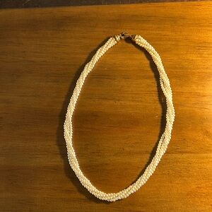 Stranded imitation pearl necklace.